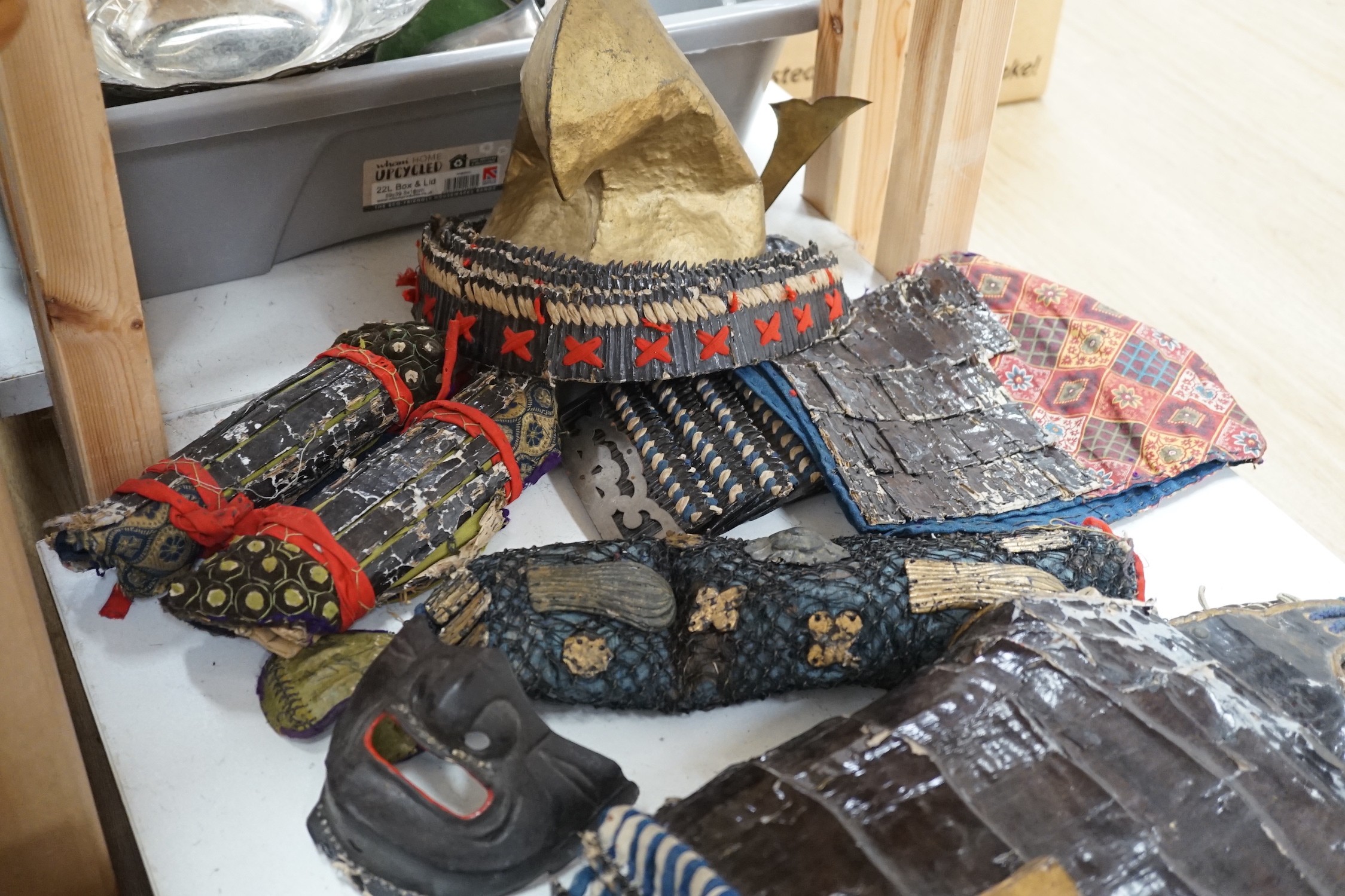 A 19th century Japanese papier mache and fabric samurai warrior costume for a child or puppet, part face mask, hat and faux chain mail bodice